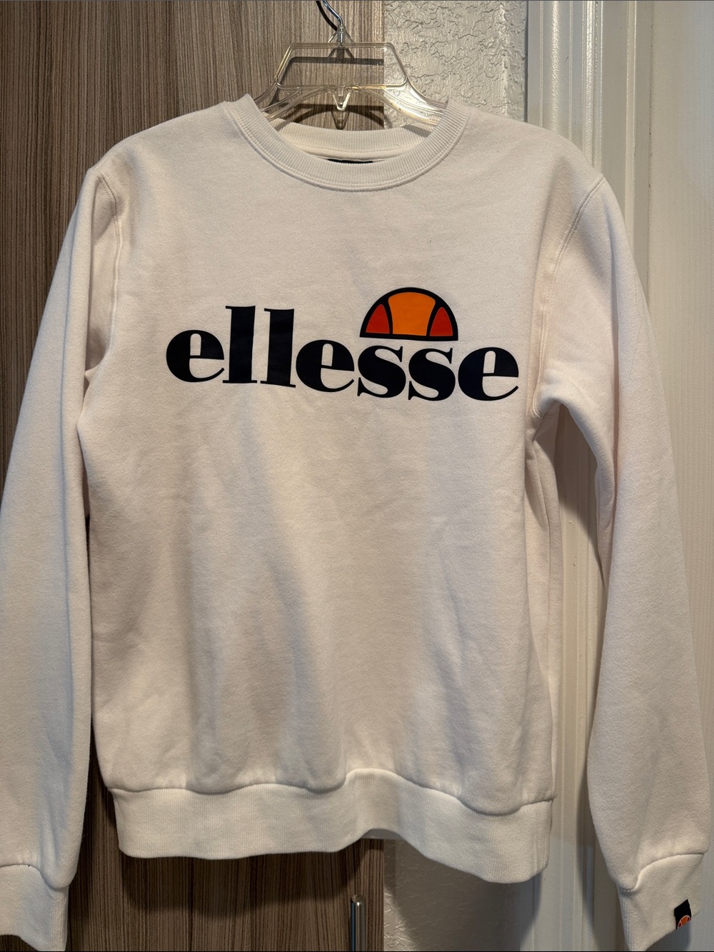 Ellesse White Crewneck Sweatshirt with Black Logo and Orange Accent